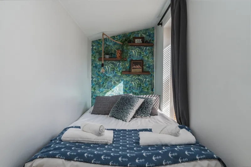 Double bed with towels folded on the end