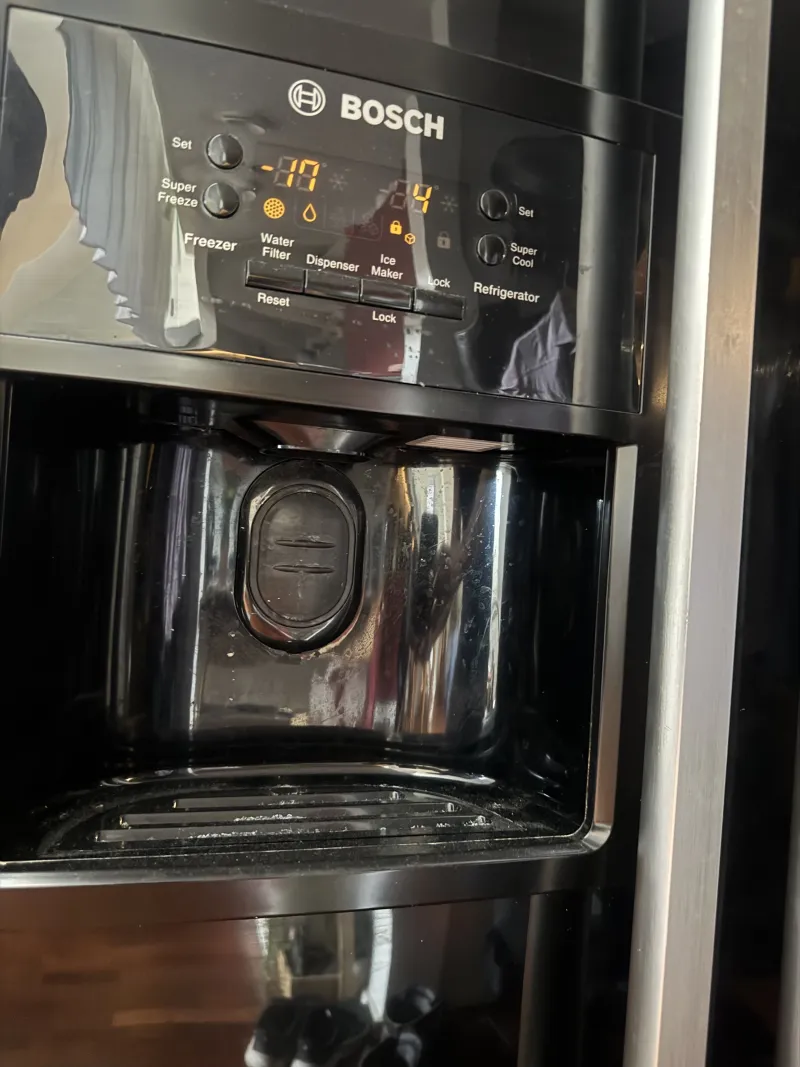 The ice maker compartment in the fridge door