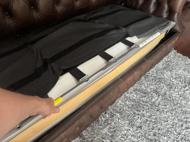 The bed frame lifted part way out of the sofa