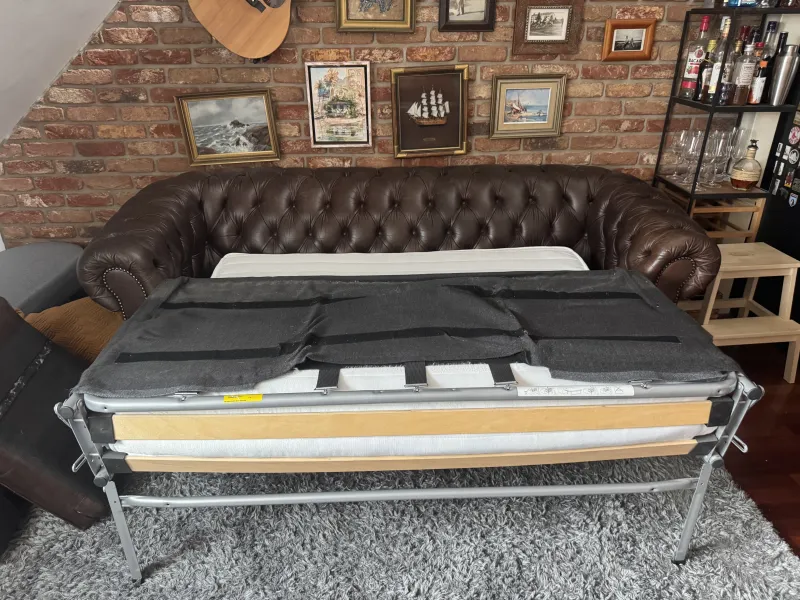 The sofa bed fully extended with the mattress in place