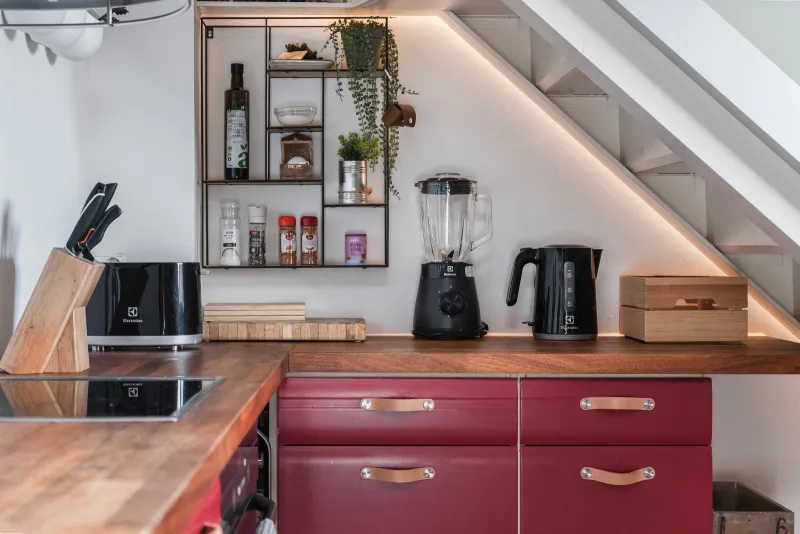 Kitchen counter with kettle, blender, toaster and knife block