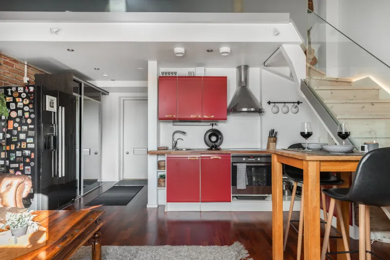 Open plan kitchen and living space with the entrance hall beyond
